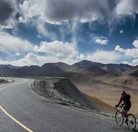Cyclists ride along the Karakoram Highway
