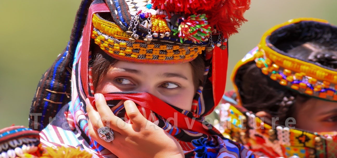 Kalash Woman – A local Kalash woman wearing traditional attire and jewelry