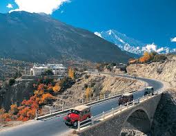 Baltistan Deosai Hunza Kalash Tour – Scenic view of a valley with autumn-colored trees