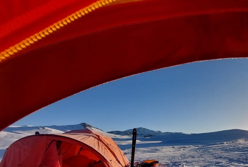 Winter Ski Traversing Deosai Plateau – A skier navigating through the snowy terrain
